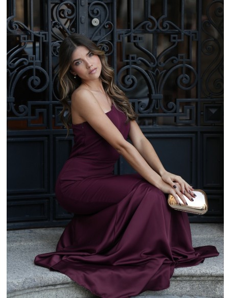 Long burgundy mermaid cut dress with asymmetrical neckline and cape