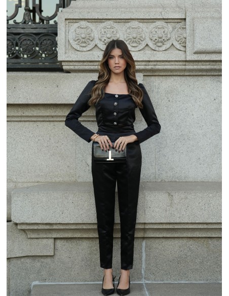 Élégant pantalon noir à taille haute avec poches latérales et fermetures éclair invisibles