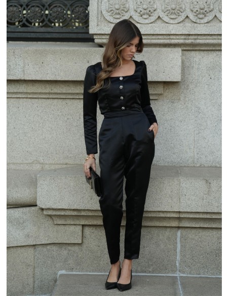 Black structured blouse with square neckline and long sleeves