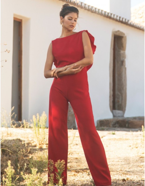 Long red jumpsuit with closed neckline and ruffle at the...
