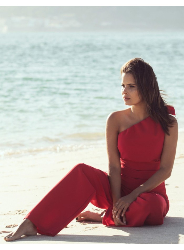 Asymmetrical red jumpsuit with lacing at the...