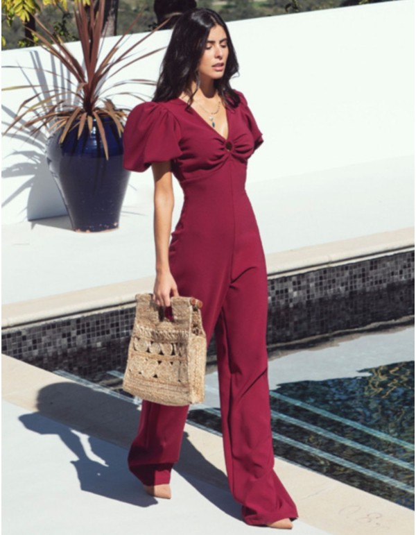 Burgundy jumpsuit with puffed sleeves and knotted back