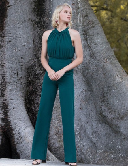 Green party jumpsuit with draped halter neckline
