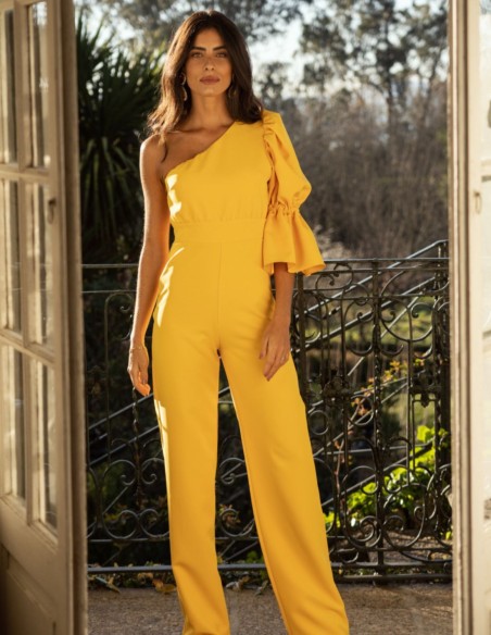 Yellow long jumpsuit with asymmetrical neckline and puffed sleeves