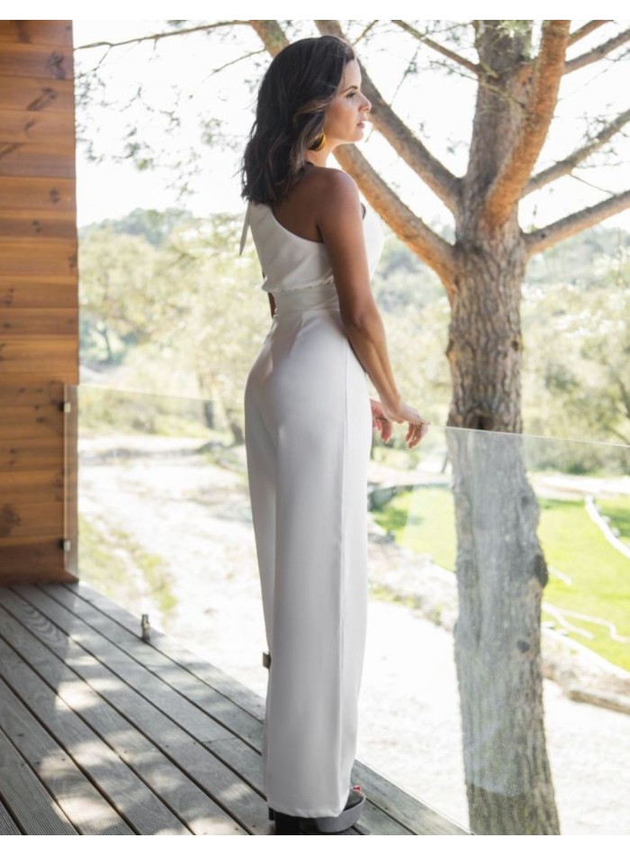 Long white jumpsuit with asymmetrical neckline...