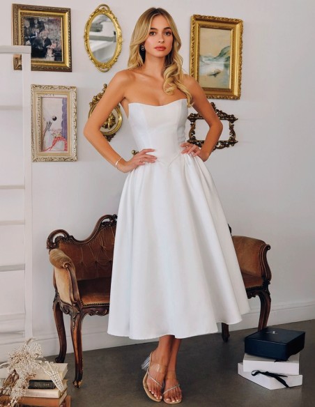 Strapless wedding dress with midi skirt with flounced skirt