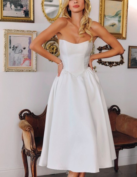 Strapless wedding dress with midi skirt with flounced skirt