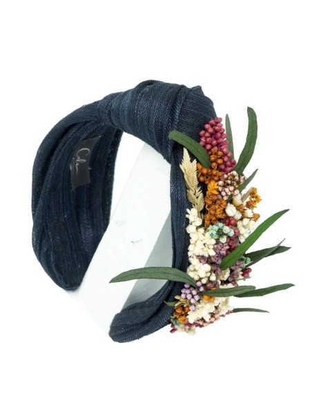 Navy blue headband with floral ornament on the side