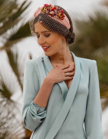 Ruffled party headband with knots and floral side trimming