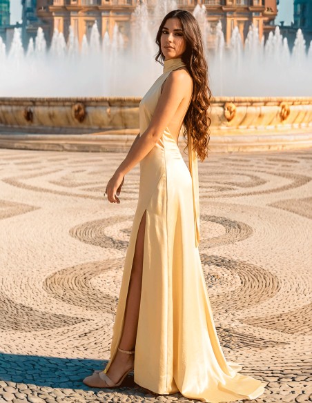 Pastel yellow satin prom dress with halter neckline and open back