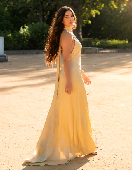 Pastel yellow satin prom dress with halter neckline and open back