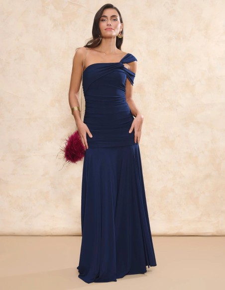 Long blue guest dress with asymmetrical neckline and long cape cut