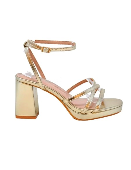 Gold strappy sandals with wide heels and platform