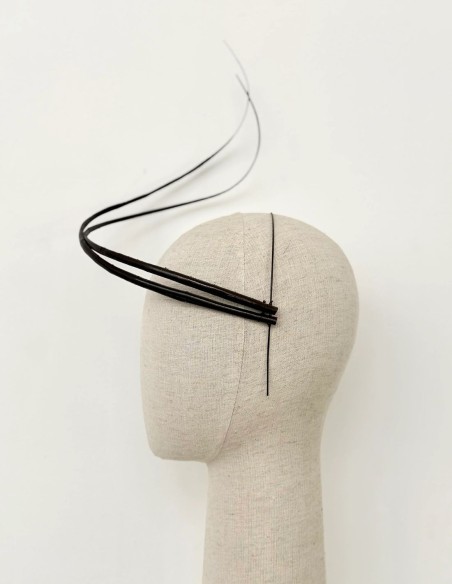 Minimalist headdress with wraparound rachis