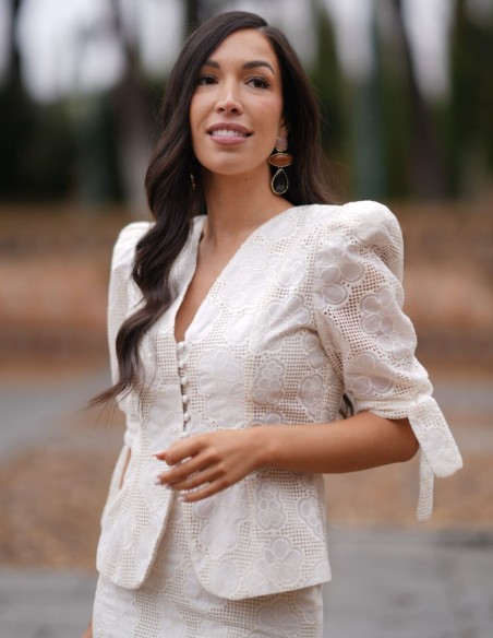 Two-piece set with button-down jacket and pencil skirt in perforated fabric