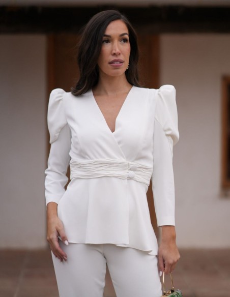 Two-piece white crepe pants and jacket ensemble