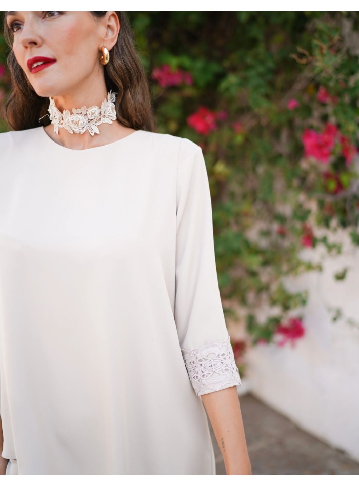 Ivory two-piece set with asymmetrical blouse