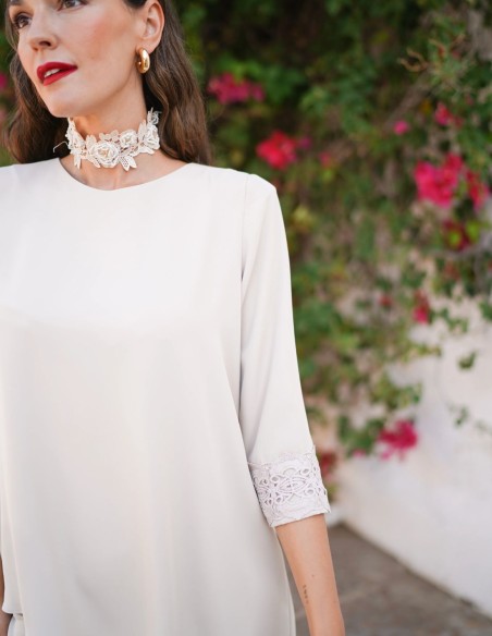 Ivory two-piece set with asymmetrical blouse