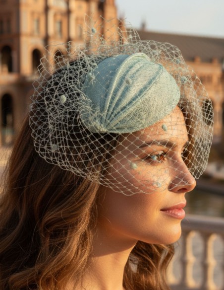 Water green guest headdress with lattice veil