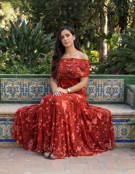 Guest dress printed in rust color with bardot neckline
