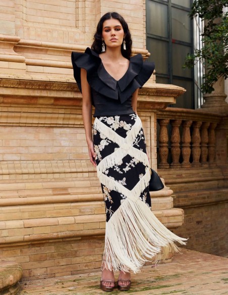 Black midi skirt with floral embroidery and ivory bangs