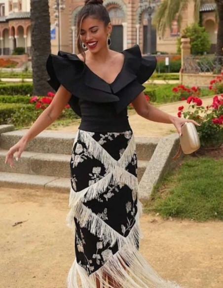 Falda de corte midi negra con bordado y flecos en color marfil