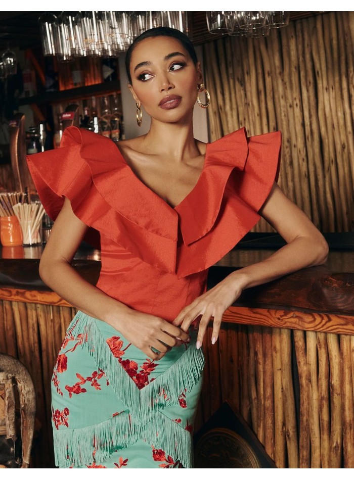 Red taffeta top with ruffles at the neckline...