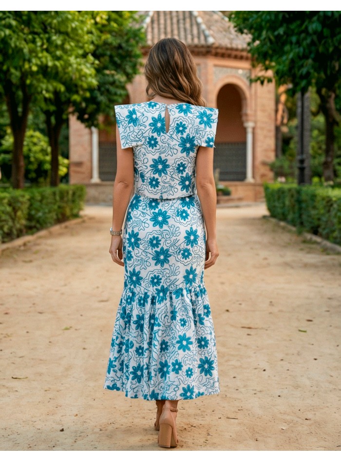 Blue embroidered ensemble with structured top...