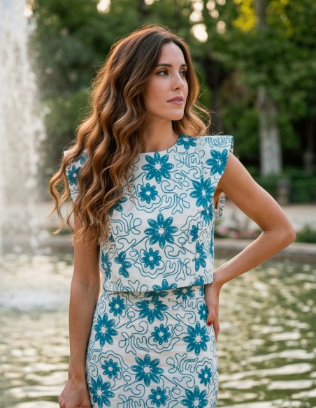 Blue embroidered ensemble with structured top and mermaid midi skirt