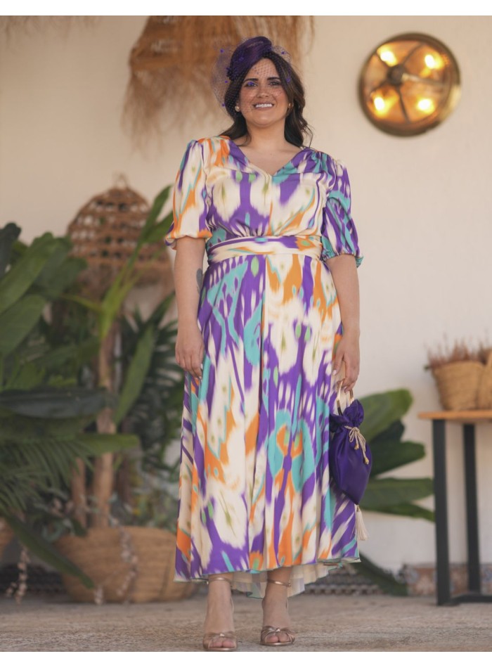 Vestido midi de invitada con tejido fluido...