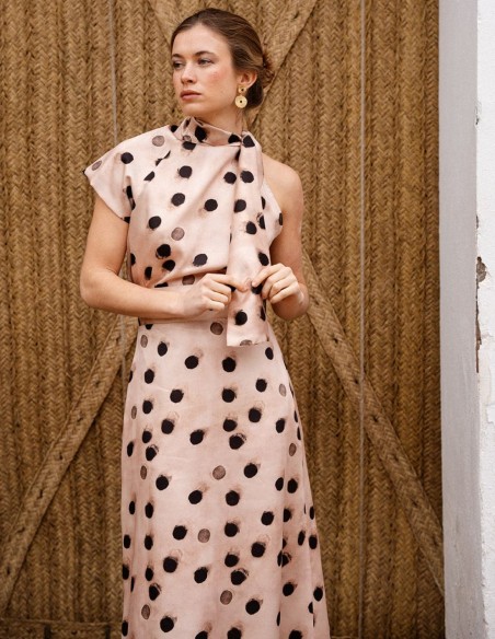 Asymmetrical short sleeve top with polka dot print and lacing