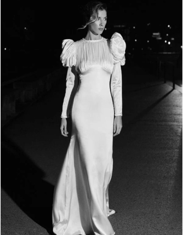 Wedding dress with puffed sleeves and draping at the... 2