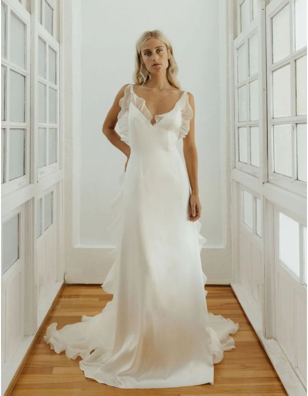 Wedding dress made of satin and organza with volumes and...