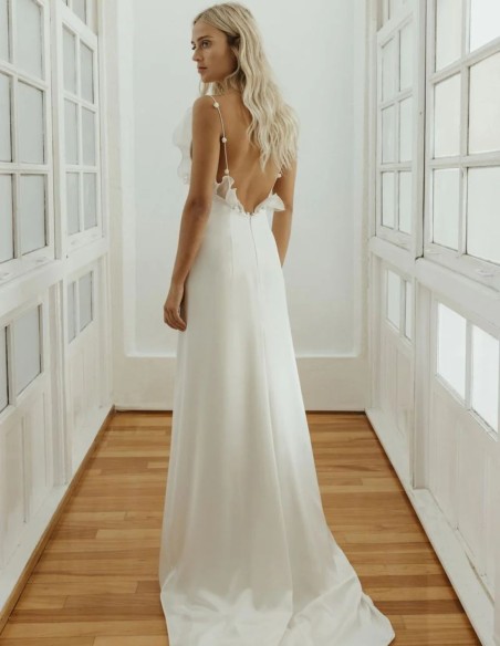 Wedding dress made of satin and organza with volumes and transparencies
