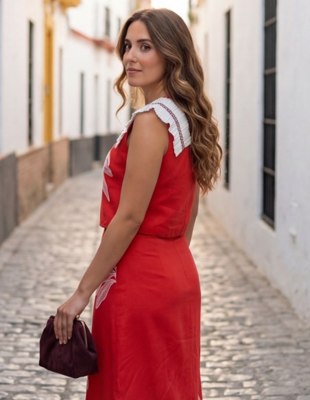 Coral two-piece ensemble with structured top and midi skirt
