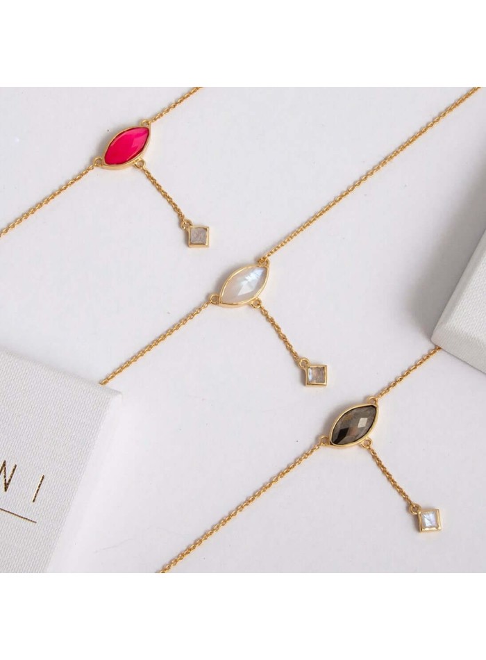 Multichain pendant with fuchsia colored stone