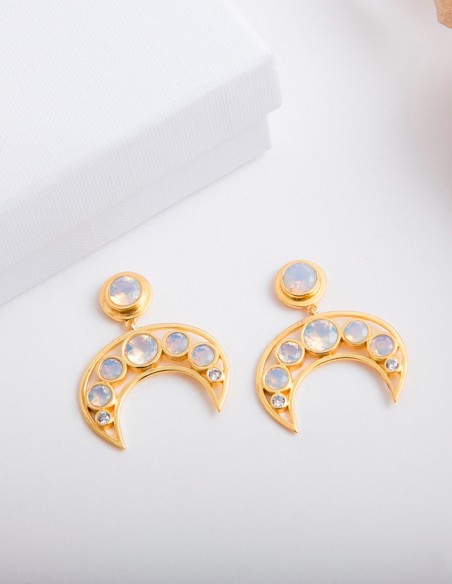 Impressive crescent-shaped party earrings with white inlaid natural stones.