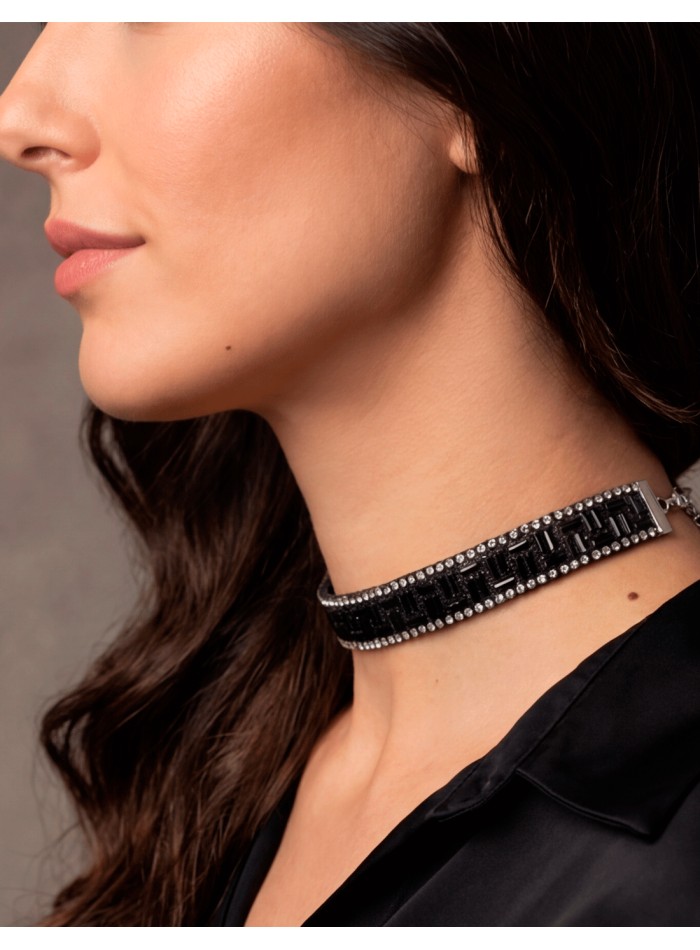 This black crystal rhinestone choker is an elegant piece with character, designed to add sophistication and depth to any look.