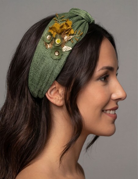 Headband made of green silk sinamay with flower details