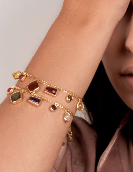 Golden bracelet with colored stone pendants in different geometric shapes