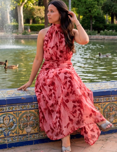 Pink printed halter midi dress in pink tones for guests