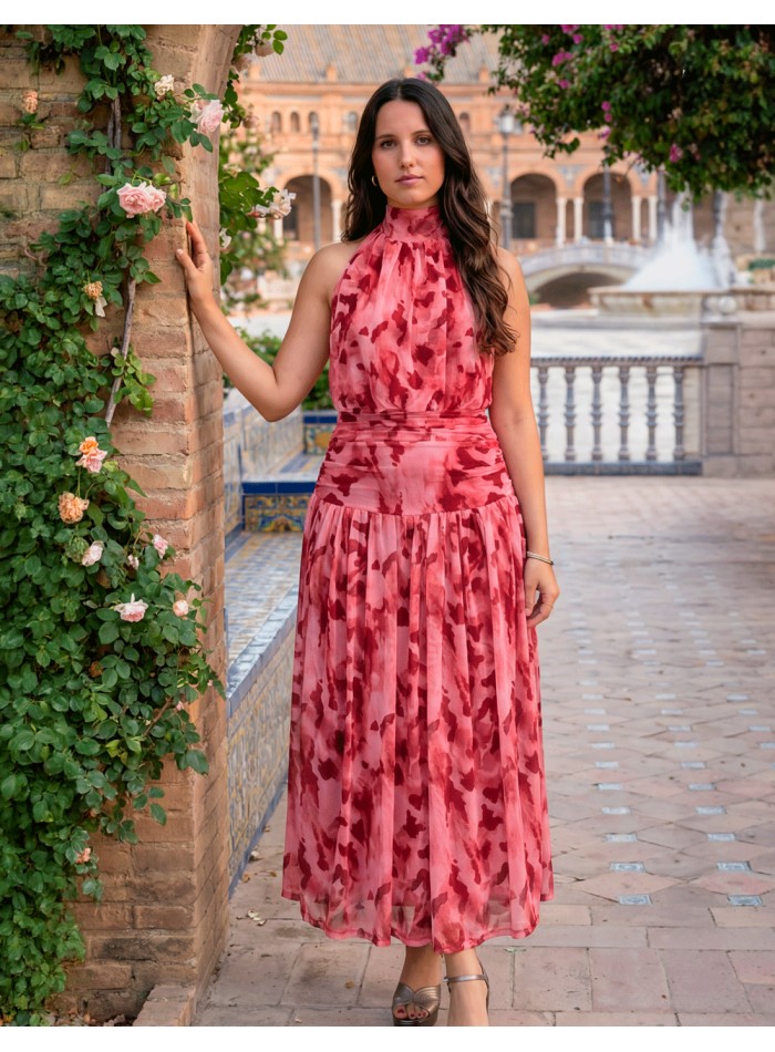 Robe midi dos nu imprimée dans les tons roses pour l'invitée