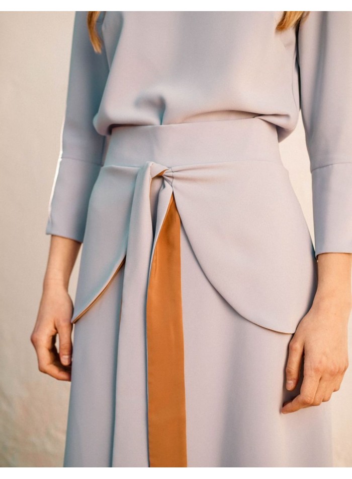 Flared skirt in lavender color with ruffle at...