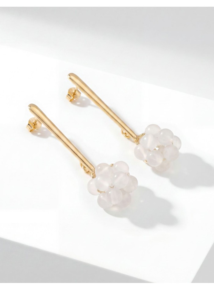 Long gold plated steel earrings with white quartz
