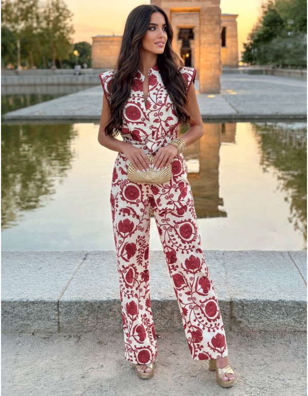 Wedding guest outfit with pants and printed top in wine tones