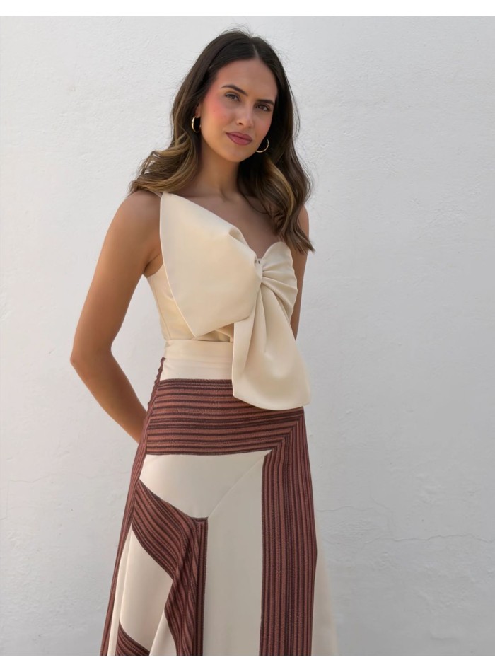 Top bustier ivoire avec nœud structuré sur le...