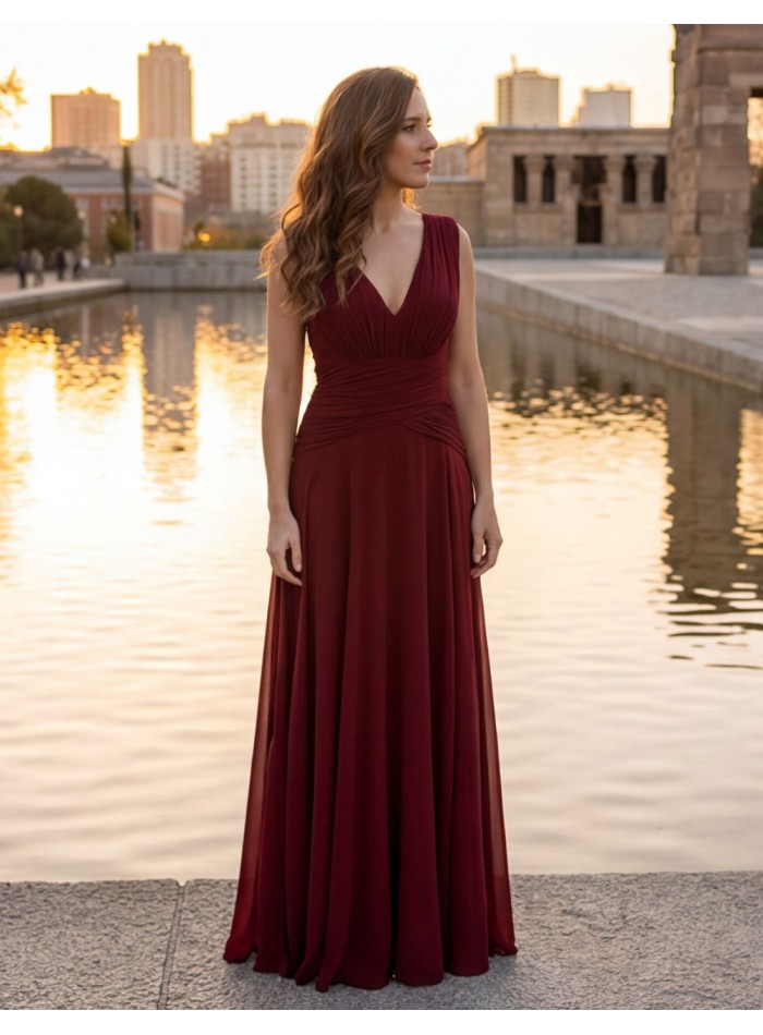 Long burgundy dress with V-neckline and draped...