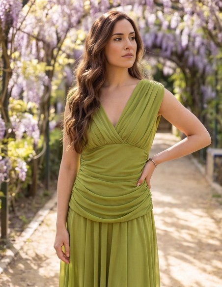 Pistachio green midi dress with draped waist and flowing skirt