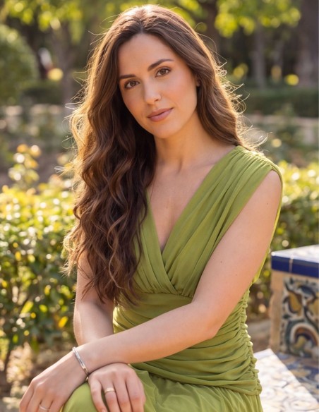 Pistachio green midi dress with draped waist and flowing skirt