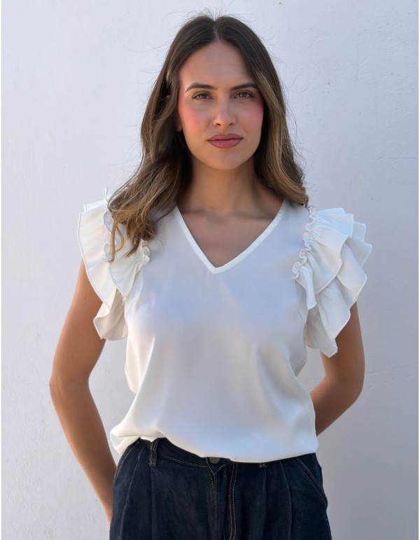 White blouse with V-neckline and ruffles on the sleeves